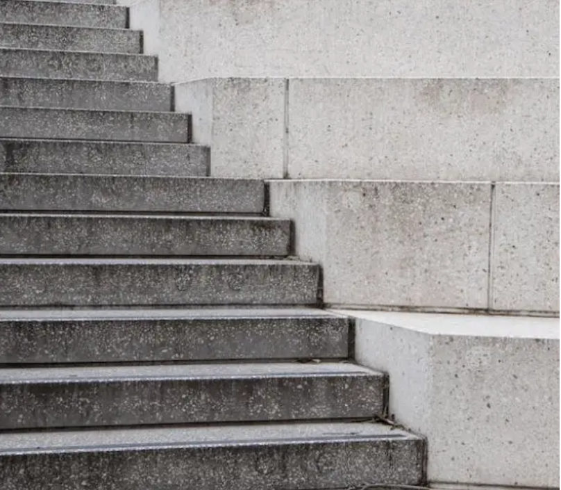 Steps in need of stucco repair. 